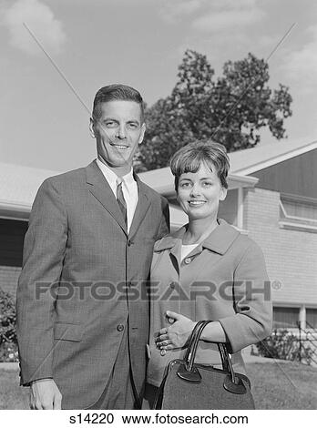 1960S Portrait Smiling Couple In Front Of Suburban House View Large Photo Image Stock Image - 1960S Portrait Smiling Couple In Front Of Suburban House. Fotosearch