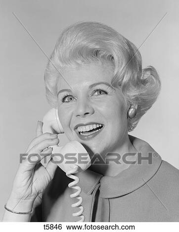 1960S Portrait Smiling Stylish Woman Talking On Telephone View Large Photo Image Stock Photograph - 1960S Portrait Smiling Stylish Woman Talking On Telephone . Fotosearch