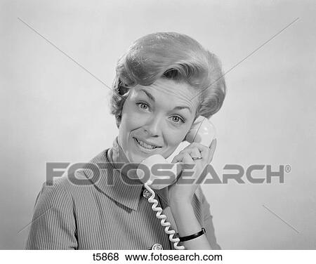 1960S Portrait Smiling Woman Talking On Telephone View Large Photo Image Stock Photo - 1960S Portrait Smiling Woman Talking On Telephone . Fotosearch