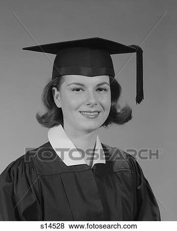 1960S Portrait Smiling Young Woman Wearing Graduation Cap And Gown Looking At Camera View Large Photo Image Stock Photo - 1960S Portrait Smiling Young Woman Wearing Graduation Cap And Gown Looking At Camera. Fotosearch