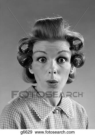 Stock Photo - 1960S Portrait Woman With Hair In Rollers Eyes Wide With Surprise. Fotosearch
