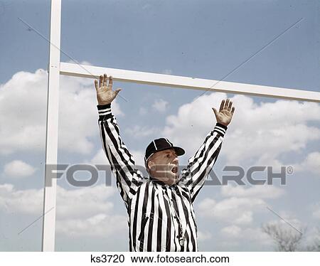 1960S Referee At American Football Game Making Good Touchdown Signal At Goal Post View Large Photo Image Stock Image - 1960S Referee At American Football Game Making Good Touchdown Signal At Goal Post . Fotosearch