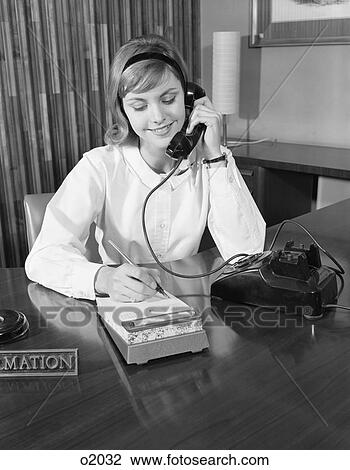 1960S Secretary Receptionist Talking On Telephone Writing Into Desk Calendar View Large Photo Image Stock Image - 1960S Secretary Receptionist Talking On Telephone Writing Into Desk Calendar. Fotosearch