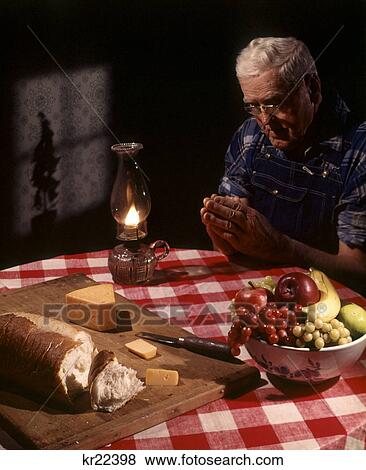 1960S Senior Elderly Man Praying Saying Prayer Thanksgiving Table Lamp Fruit Bread Cheese Religion View Large Photo Image Stock Photo - 1960S Senior Elderly Man Praying Saying Prayer Thanksgiving Table Lamp Fruit Bread Cheese Religion. Fotosearch
