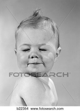 1960S Side View Of Portrait Baby With Chin On Shoulder & Closed Eyes Smirking Turning Head Toward Camera View Large Photo Image Picture - 1960S Side View Of Portrait Baby With Chin On Shoulder & Closed Eyes Smirking Turning Head Toward Camera. Fotosearch