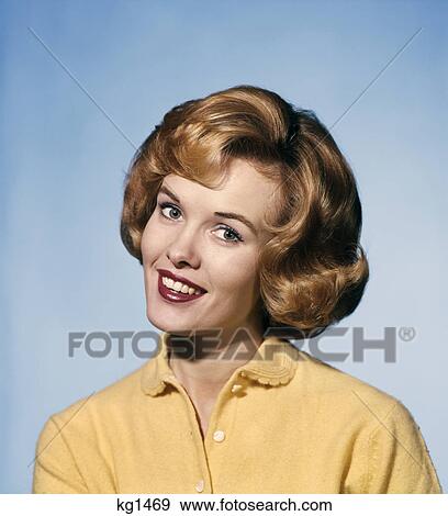 1960S Smiling Blond Woman Wearing A Yellow Sweater Head Tilted Quizzical Expression View Large Photo Image Stock Photo - 1960S Smiling Blond Woman Wearing A Yellow Sweater Head Tilted Quizzical Expression . Fotosearch