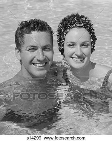 1960S Smiling Couple Man Woman In Swimming Pool View Large Photo Image Stock Photo - 1960S Smiling Couple Man Woman In Swimming Pool. Fotosearch