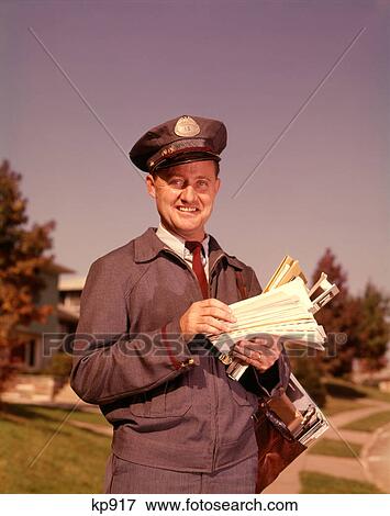 1960S Smiling Mailman Holding Letters Mail Leather Mailbag In Suburban Neighborhood View Large Photo Image Stock Photo - 1960S Smiling Mailman Holding Letters Mail Leather Mailbag In Suburban Neighborhood . Fotosearch