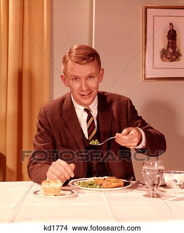 1960S Smiling Man Eating Dinner At Table With Fork Full Of Peas View Large Photo Image Picture - 1960S Smiling Man Eating Dinner At Table With Fork Full Of Peas . Fotosearch