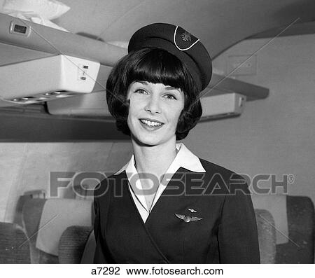 1960S Smiling Portrait Of Airline Stewardess In Airplane Aisle View Large Photo Image Stock Image - 1960S Smiling Portrait Of Airline Stewardess In Airplane Aisle. Fotosearch