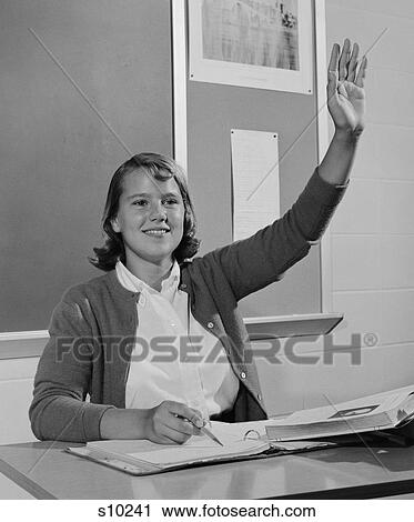 1960S Smiling Teen Girl Sitting Classroom Desk Raising Her Hand View Large Photo Image Stock Image - 1960S Smiling Teen Girl Sitting Classroom Desk Raising Her Hand. Fotosearch