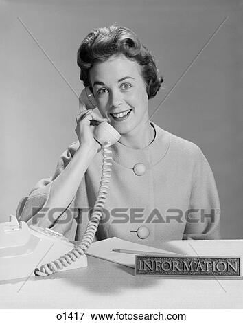 1960S Smiling Woman Secretary Talking On Telephone Information Desk View Large Photo Image Stock Photo - 1960S Smiling Woman Secretary Talking On Telephone Information Desk . Fotosearch