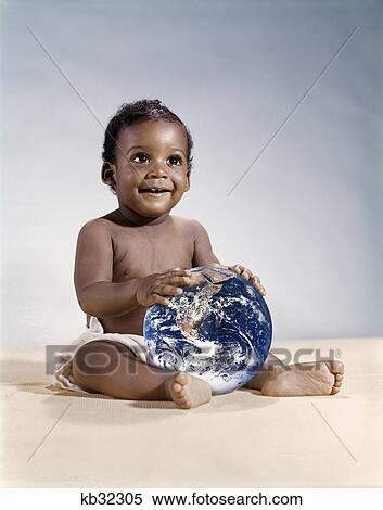1960S Symbolic Ecology Serious Smiling African American Baby Wearing Cloth Diapers Sitting Holding The Earth Looking To The Future View Large Photo Image Stock Photography - 1960S Symbolic Ecology Serious Smiling African American Baby Wearing Cloth Diapers Sitting Holding The Earth Looking To The Future. Fotosearch