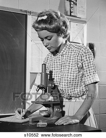 1960S Teen Girl Writing Notes Working With Microscope In Science Classroom View Large Photo Image Stock Image - 1960S Teen Girl Writing Notes Working With Microscope In Science Classroom. Fotosearch