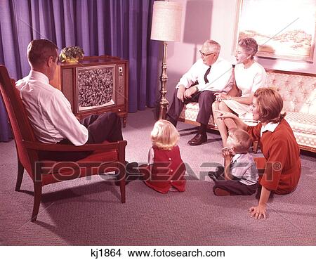 1960S Three Generation Family Watching Television In Living Room View Large Photo Image Picture - 1960S Three Generation Family Watching Television In Living Room. Fotosearch