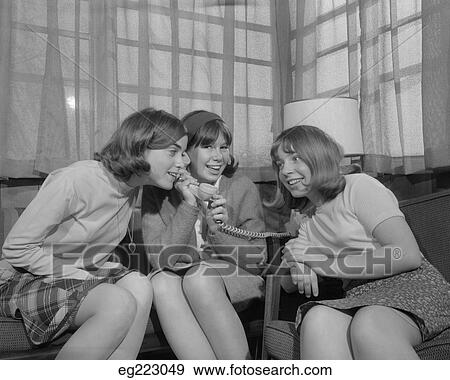 1960S Three Young Teen Girls Sitting Together Inside Listening In On Telephone View Large Photo Image Stock Photo - 1960S Three Young Teen Girls Sitting Together Inside Listening In On Telephone. Fotosearch