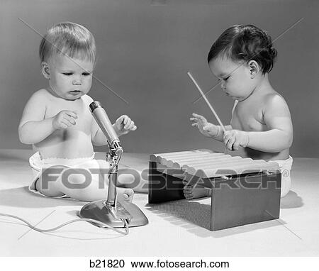 1960S Two Babies In Diapers With Microphone And Toy Xylophone Musical Instrument Playing Together View Large Photo Image Stock Image - 1960S Two Babies In Diapers With Microphone And Toy Xylophone Musical Instrument Playing Together. Fotosearch
