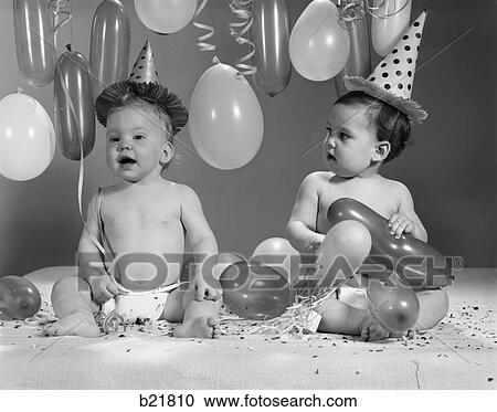 1960S Two Babies Wearing Party Hats With Balloons View Large Photo Image Stock Image - 1960S Two Babies Wearing Party Hats With Balloons. Fotosearch