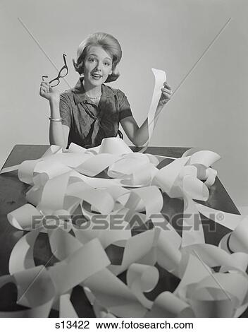 1960S Woman Holding Eyeglasses And End Of Extremely Long Tape From Office Machine View Large Photo Image Stock Image - 1960S Woman Holding Eyeglasses And End Of Extremely Long Tape From Office Machine . Fotosearch