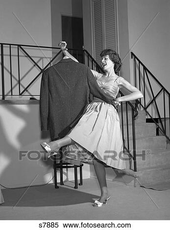 1960S Woman In Cocktail Dress Dancing With Man'S Empty Jacket View Large Photo Image Stock Photography - 1960S Woman In Cocktail Dress Dancing With Man'S Empty Jacket. Fotosearch