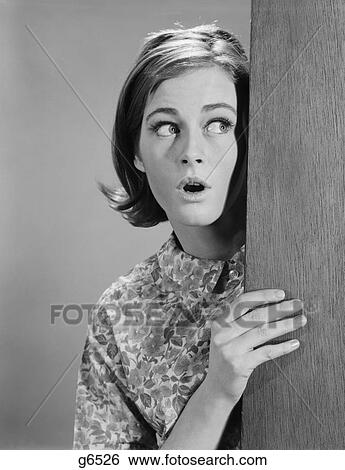 1960S Woman Peeking Around Door Corner With Fearful Expression View Large Photo Image Stock Photograph - 1960S Woman Peeking Around Door Corner With Fearful Expression. Fotosearch