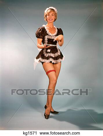 1960S Woman Smiling Wearing Short Black & White Lace French Maid Costume Pointing To Silver Tray View Large Photo Image Stock Image - 1960S Woman Smiling Wearing Short Black & White Lace French Maid Costume Pointing To Silver Tray . Fotosearch