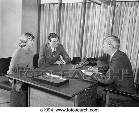 1960S Young Couple At Desk Meeting With Businessman View Large Photo Image Picture - 1960S Young Couple At Desk Meeting With Businessman . Fotosearch