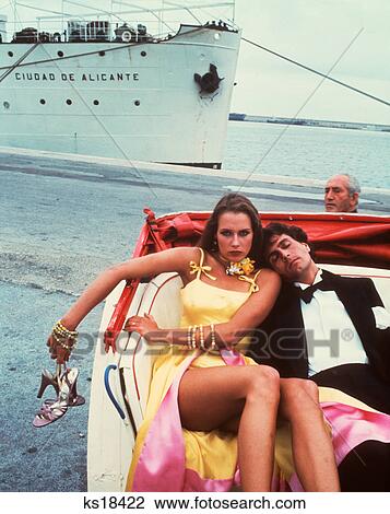 1970S 1980S Couple In Open Hansom Cab Man Tuxedo Asleep Woman Angry On Dock Cruise Ship Bystander View Large Photo Image Stock Image - 1970S 1980S Couple In Open Hansom Cab Man Tuxedo Asleep Woman Angry On Dock Cruise Ship Bystander . Fotosearch