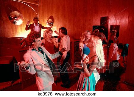 Stock Photo - 1970S 1980S Couples Men Women Dancing Disco Discotheque Indoor Dj In Back. Fotosearch