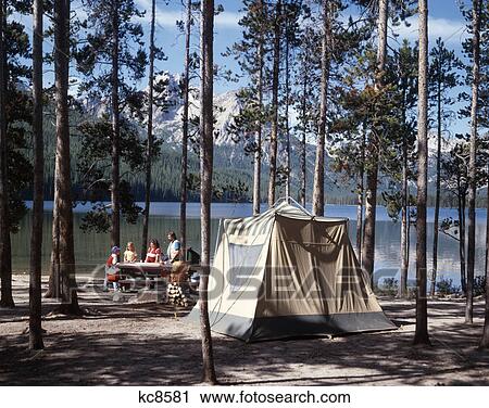 Stock Image - 1970S 1980S Family Camping Stanley Lake Sawtooth Mountains Idaho Usa. Fotosearch