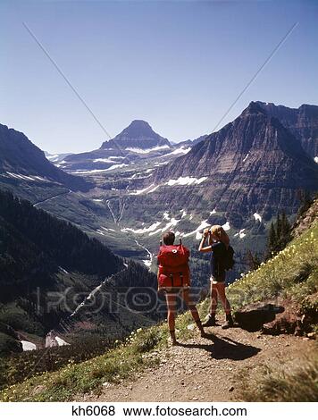 1970S 1980S Female Hikers On Granite Park Trail Glacier National Park Montana View Large Photo Image Stock Photo - 1970S 1980S Female Hikers On Granite Park Trail Glacier National Park Montana. Fotosearch