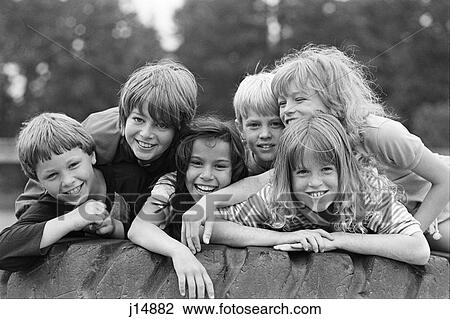 1970S 1980S Group Of Six Boys & Girls Gathered Together On Large Playground Tire View Large Photo Image Stock Image - 1970S 1980S Group Of Six Boys & Girls Gathered Together On Large Playground Tire. Fotosearch