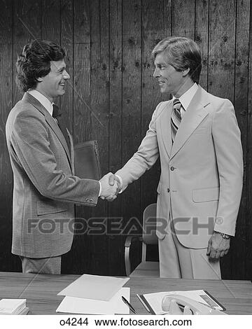 1970S 1980S Two Businessmen Shaking Hands Handshake View Large Photo Image Picture - 1970S 1980S Two Businessmen Shaking Hands Handshake. Fotosearch
