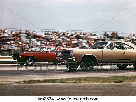 1970S 2 Cars Drag Racing At The Brownsville Indiana Raceway View Large Photo Image Picture - 1970S 2 Cars Drag Racing At The Brownsville Indiana Raceway . Fotosearch