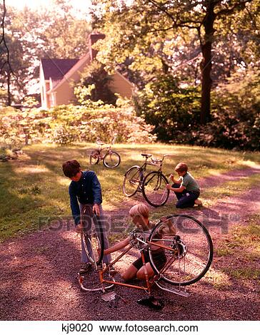 1970S 3 Boys Backyard Driveway Suburban House Work On Bicycle Maintenance Repair View Large Photo Image Stock Image - 1970S 3 Boys Backyard Driveway Suburban House Work On Bicycle Maintenance Repair . Fotosearch