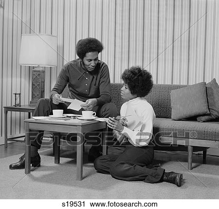 1970S African American Couple Living Room Talking Over Coffee View Large Photo Image Stock Image - 1970S African American Couple Living Room Talking Over Coffee . Fotosearch