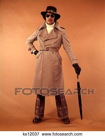 1970S African American Young Man Fashion Trench Coat Hat Sunglasses Dude Cool Hip Clothes View Large Photo Image Stock Photo - 1970S African American Young Man Fashion Trench Coat Hat Sunglasses Dude Cool Hip Clothes . Fotosearch