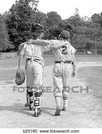 1970S Back View Of Pair Of Little Leaguers Walking Off Of Field With Arms Around Each Other View Large Photo Image Stock Image - 1970S Back View Of Pair Of Little Leaguers Walking Off Of Field With Arms Around Each Other. Fotosearch