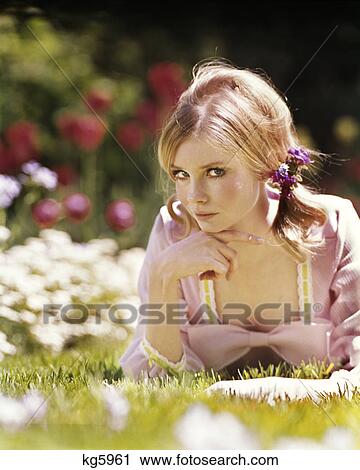 1970S Blond Young Woman In Pink Dress Lying In Grass View Large Photo Image Stock Image - 1970S Blond Young Woman In Pink Dress Lying In Grass . Fotosearch