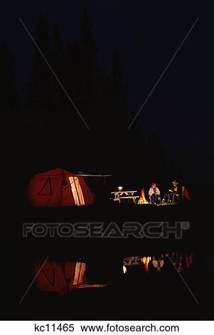 1970S Campers Sitting Outside Tent At Night By Campfire View Large Photo Image Stock Photography - 1970S Campers Sitting Outside Tent At Night By Campfire. Fotosearch