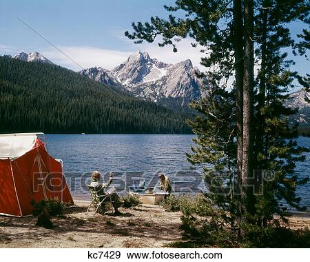 1970S Couple Camping Stanley Lake, Id View Large Photo Image Stock Photo - 1970S Couple Camping Stanley Lake, Id. Fotosearch