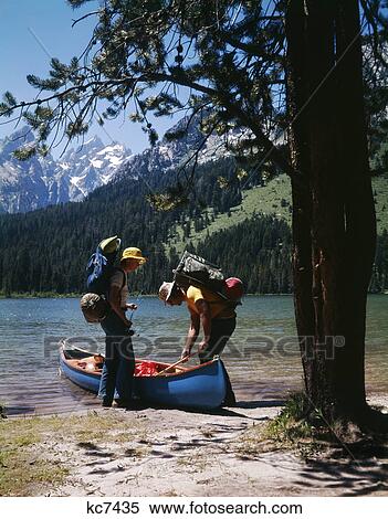 1970S Couple With Fishing Gear Canoe By String Lake Grand Teton National Park Wyoming View Large Photo Image Stock Photography - 1970S Couple With Fishing Gear Canoe By String Lake Grand Teton National Park Wyoming. Fotosearch