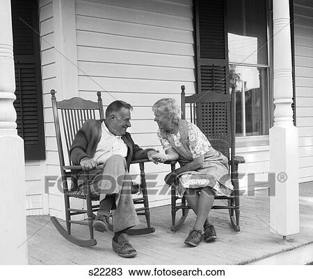 1970S Elderly Couple In Rocking Chairs On Porch Holding Hands View Large Photo Image Stock Image - 1970S Elderly Couple In Rocking Chairs On Porch Holding Hands. Fotosearch
