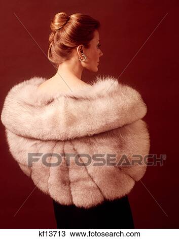 1970S Elegant Upscale Woman Back View Wearing Silver Fur Stole Coat View Large Photo Image Stock Image - 1970S Elegant Upscale Woman Back View Wearing Silver Fur Stole Coat . Fotosearch