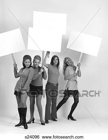 1970S Four Young Women Wearing Miniskirts And Flared Jeans Carrying Blank Signs View Large Photo Image Stock Photograph - 1970S Four Young Women Wearing Miniskirts And Flared Jeans Carrying Blank Signs . Fotosearch