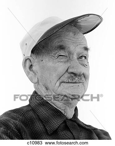 1970S Head-On Portrait Of Elderly Man Wearing Cap & Winking View Large Photo Image Stock Image - 1970S Head-On Portrait Of Elderly Man Wearing Cap & Winking. Fotosearch