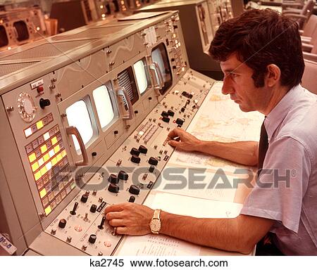 1970S Man Sitting At Control Panel Of Nasa Mission Control Houston Texas Usa View Large Photo Image Stock Photography - 1970S Man Sitting At Control Panel Of Nasa Mission Control Houston Texas Usa. Fotosearch