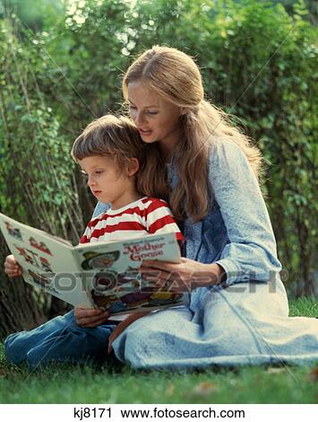 1970S Mother Reading Book To Daughter In Garden Outdoor View Large Photo Image Stock Image - 1970S Mother Reading Book To Daughter In Garden Outdoor . Fotosearch