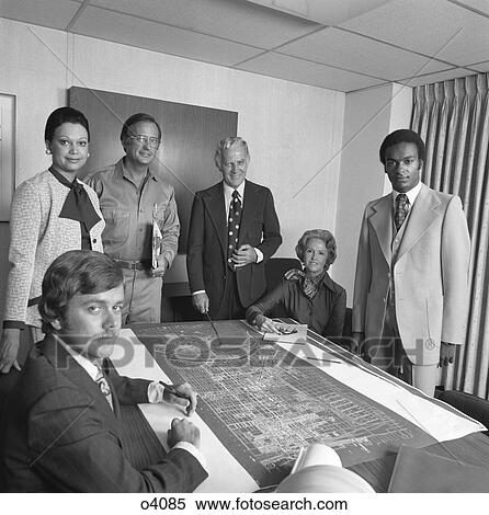 1970S Portrait 6 Business People Men & Women Around Table With Blueprints View Large Photo Image Stock Photography - 1970S Portrait 6 Business People Men & Women Around Table With Blueprints. Fotosearch