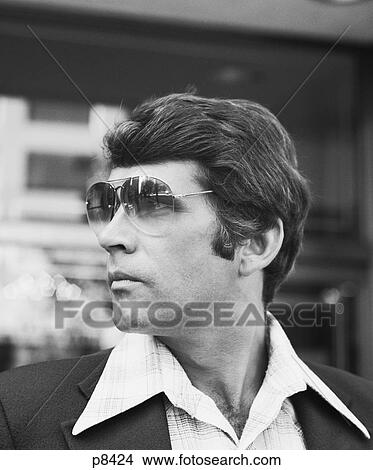 1970S Portrait Profile Man Wearing Aviator Sunglasses View Large Photo Image Picture - 1970S Portrait Profile Man Wearing Aviator Sunglasses . Fotosearch